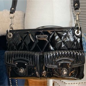 Coach black liquid gloss leather purse with silver hardware and fuschia lining